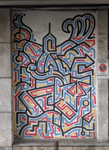 clean lines in black blue yellow red on a white wall. the lines dont follow a pattern but also dont touch
