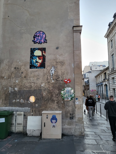 Graffiti of The Dude from the big lebowski movie, rendered with small red white and blue tiles in the style of Shepard Fairey