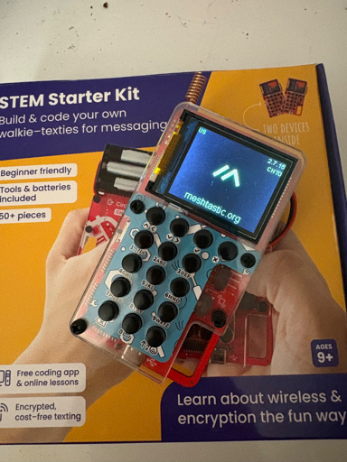 STEM project “toy” running Meshtastic firmware sitting on top of its product box. 